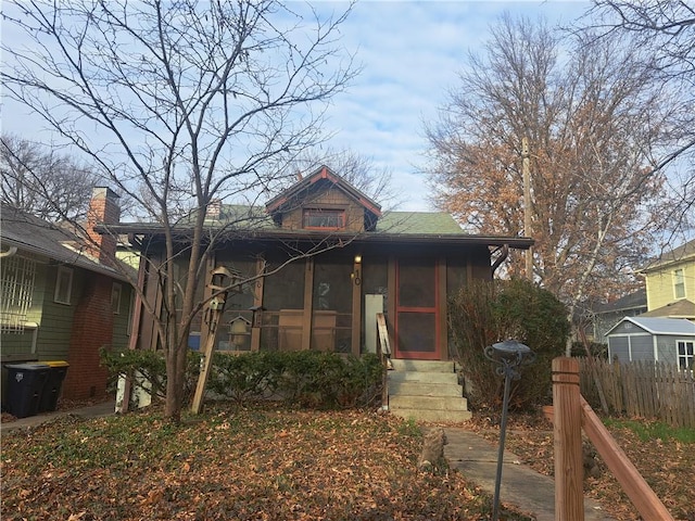 view of front of house featuring a sunroom