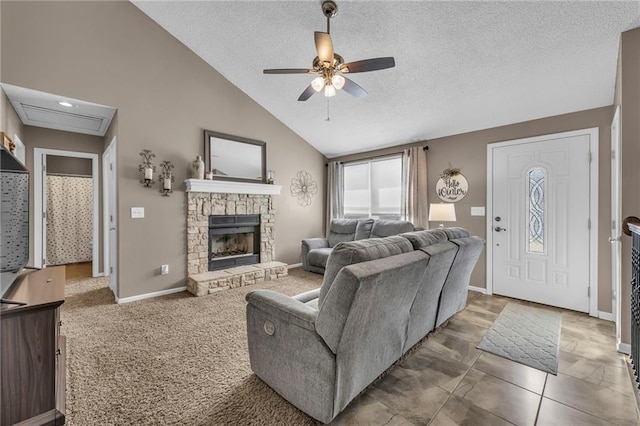 living room featuring ceiling fan, a fireplace, high vaulted ceiling, and a textured ceiling