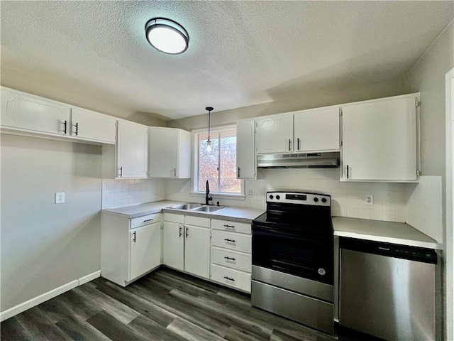 kitchen with pendant lighting, white cabinets, sink, tasteful backsplash, and stainless steel appliances