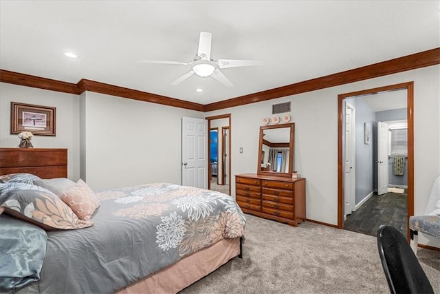 bedroom with crown molding, ceiling fan, and carpet floors