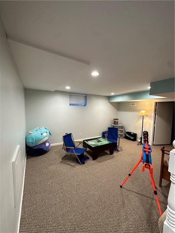 recreation room featuring carpet flooring