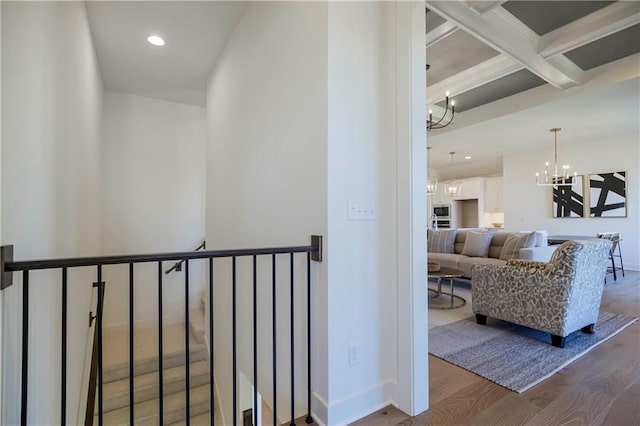 4218 W 158th Ter, Overland Park, KS 66224 - hall featuring a chandelier, wood finished floors, beamed ceiling, recessed lighting, and coffered ceiling