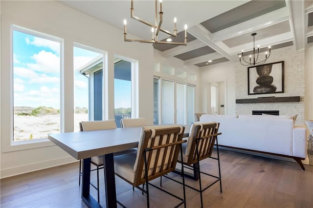 4218 W 158th Ter, Overland Park, KS 66224 - dining room featuring a chandelier, coffered ceiling, dark wood-type flooring, beam ceiling, and a fireplace