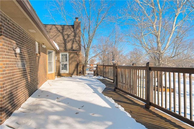 view of snow covered deck