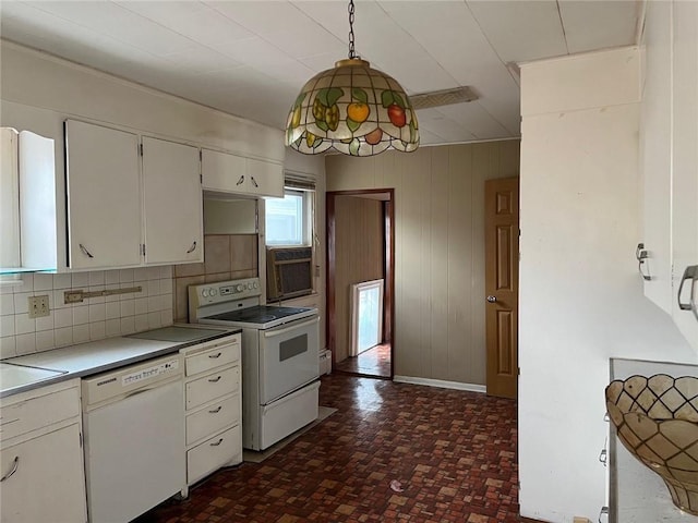 4512 Terrace St, Kansas City, MO 64111 - kitchen with decorative backsplash, white cabinetry, hanging light fixtures, and white appliances