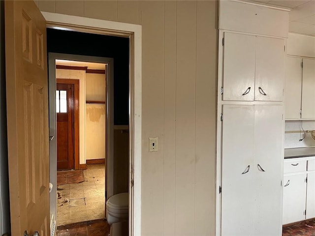 4512 Terrace St, Kansas City, MO 64111 - hallway with wooden walls