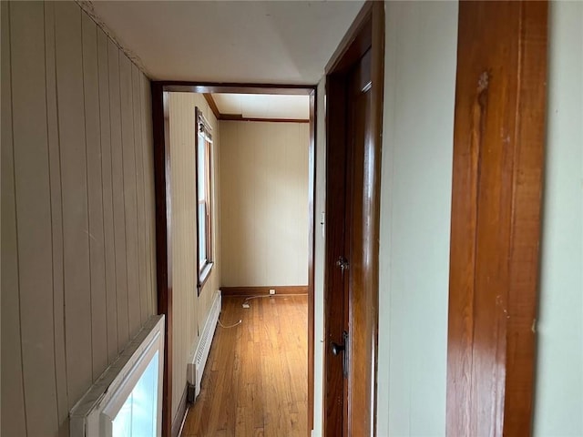 4512 Terrace St, Kansas City, MO 64111 - hall featuring crown molding, a baseboard heating unit, and hardwood / wood-style flooring