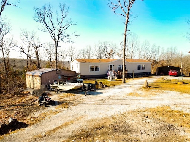 view of front of house with an outdoor structure