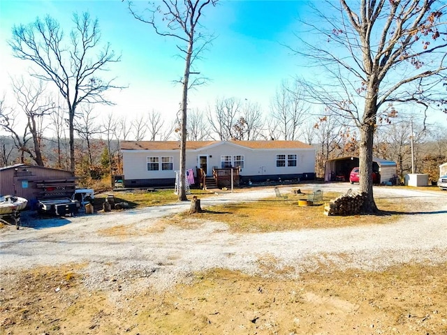 view of front of property featuring a carport