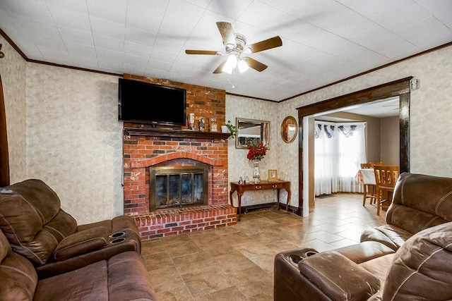 living room featuring ceiling fan, ornamental molding, and a brick fireplace