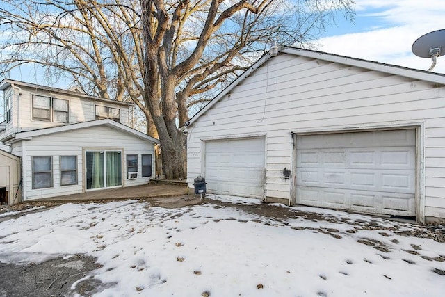 view of snow covered garage