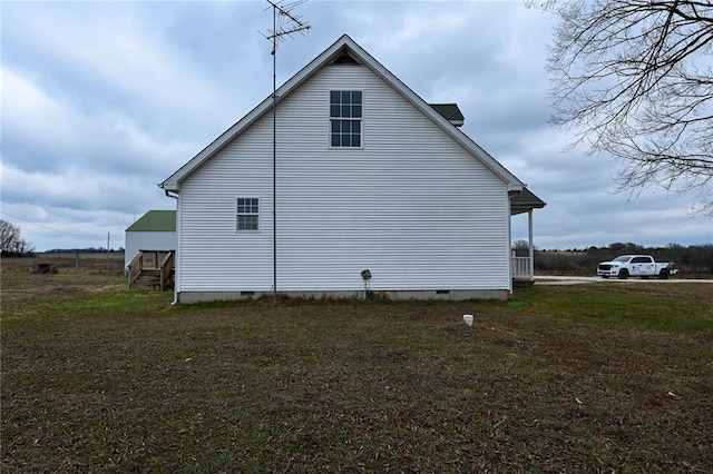 view of property exterior featuring a lawn