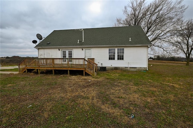 back of house with french doors, a lawn, and a wooden deck