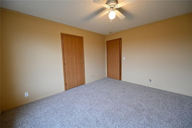 unfurnished bedroom featuring carpet, ceiling fan, a textured ceiling, and a closet