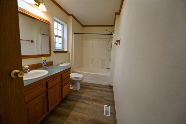 full bathroom with wood-type flooring, toilet, vanity, bathtub / shower combination, and ornamental molding