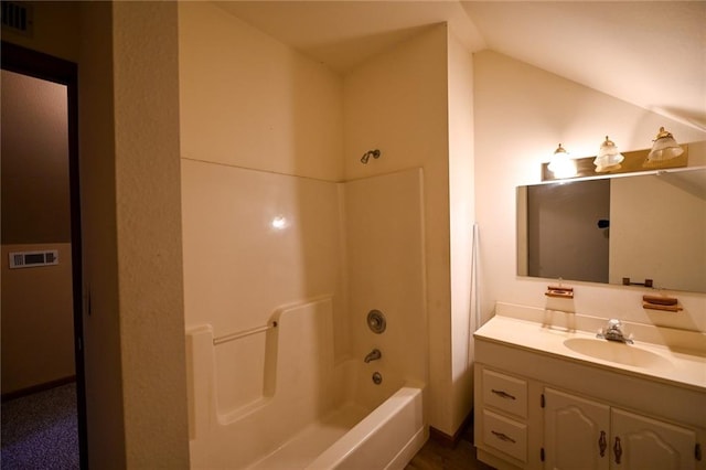 bathroom featuring vanity and washtub / shower combination