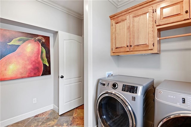 washroom with crown molding, cabinets, and separate washer and dryer