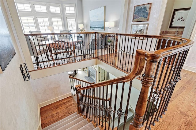 stairway featuring hardwood / wood-style flooring