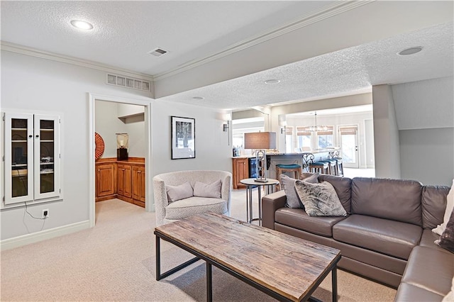 living room featuring light carpet, crown molding, and a textured ceiling