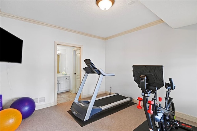 workout area with ornamental molding and light colored carpet