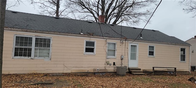 rear view of house with central air condition unit