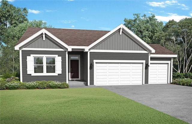 view of front of home featuring a garage and a front yard