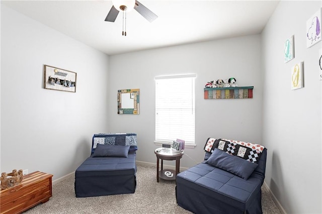 sitting room featuring carpet floors and ceiling fan