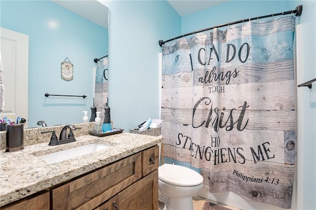 bathroom with a shower with curtain, vanity, and toilet