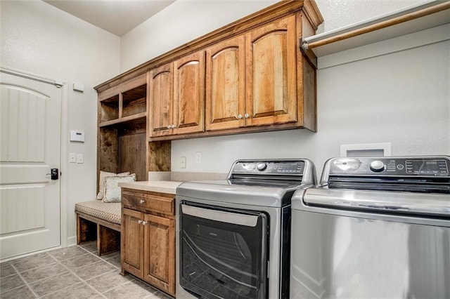 washroom with cabinets and separate washer and dryer