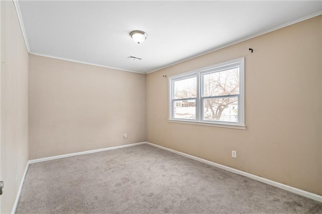 carpeted empty room featuring ornamental molding