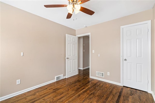 unfurnished bedroom with ceiling fan and dark hardwood / wood-style floors