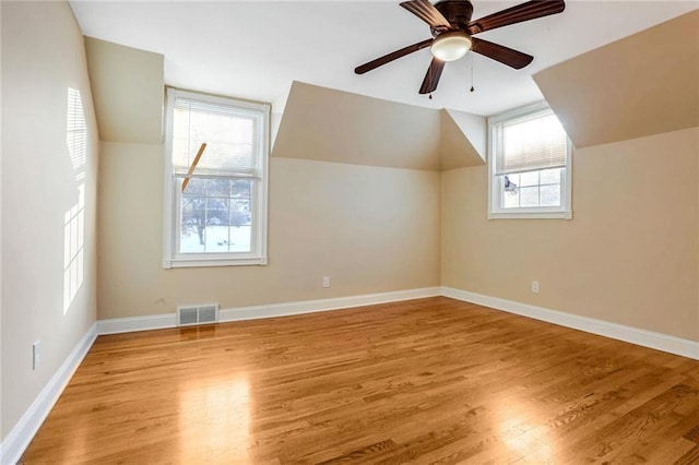 bonus room with ceiling fan, light wood-type flooring, and lofted ceiling