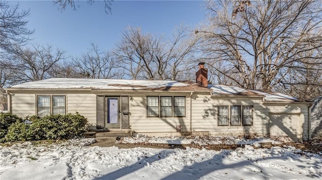 single story home featuring a garage