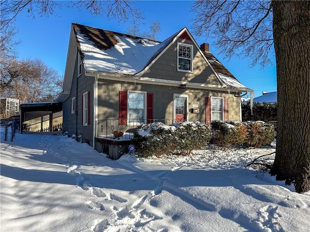 view of front of property featuring a carport