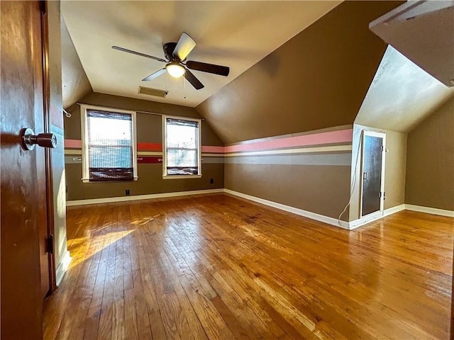 bonus room with ceiling fan, wood-type flooring, and lofted ceiling