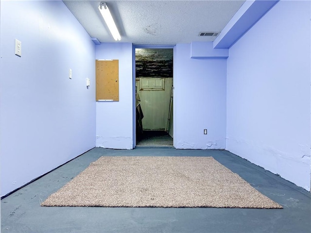 spare room featuring a textured ceiling