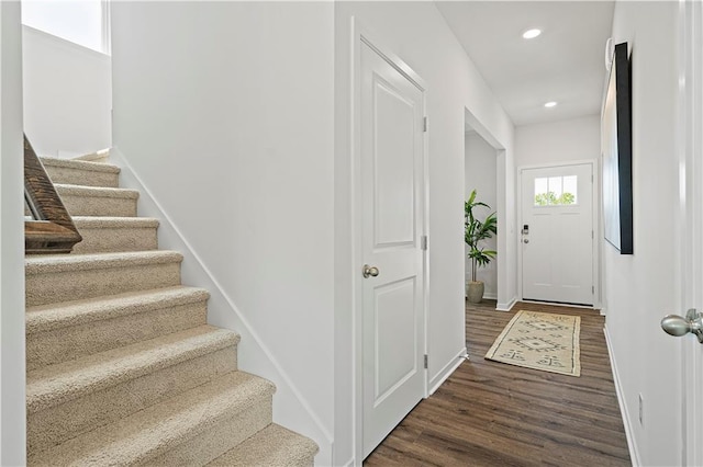 interior space featuring recessed lighting, wood finished floors, and baseboards