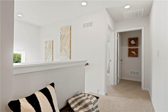 hallway featuring recessed lighting, visible vents, and carpet floors