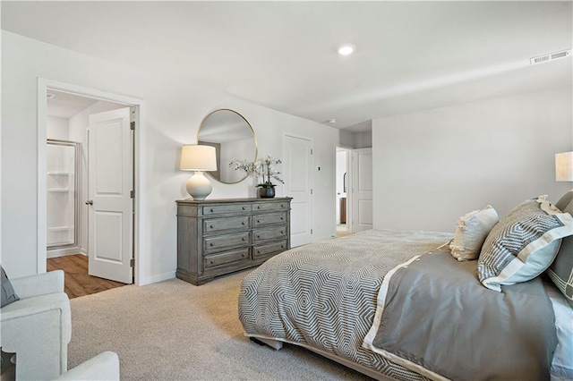 bedroom featuring recessed lighting, carpet, visible vents, and baseboards