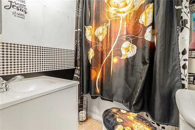 bathroom with tile patterned flooring and vanity