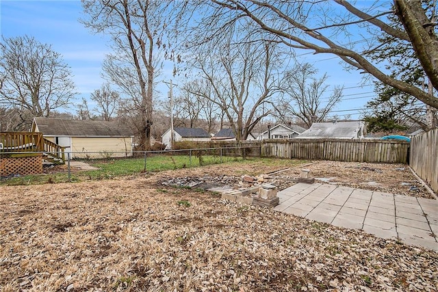 view of yard with a deck and a patio area