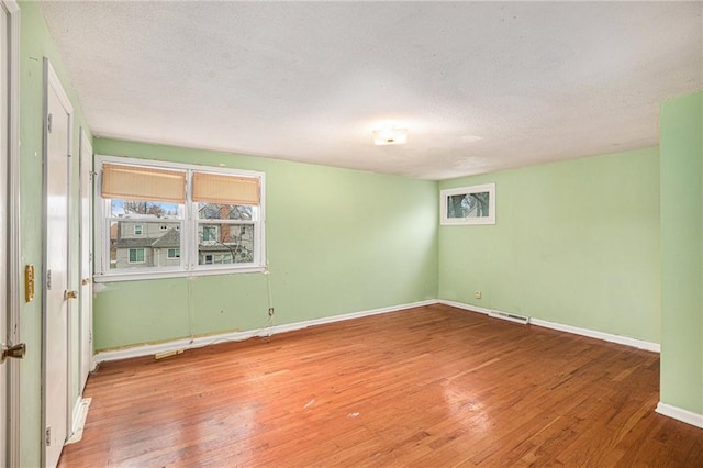 empty room featuring hardwood / wood-style floors