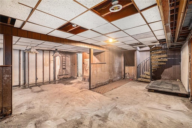 basement featuring a paneled ceiling