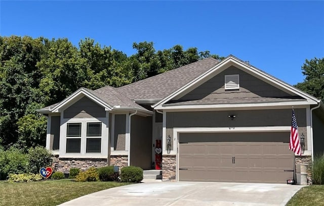 craftsman-style home with a front lawn and a garage