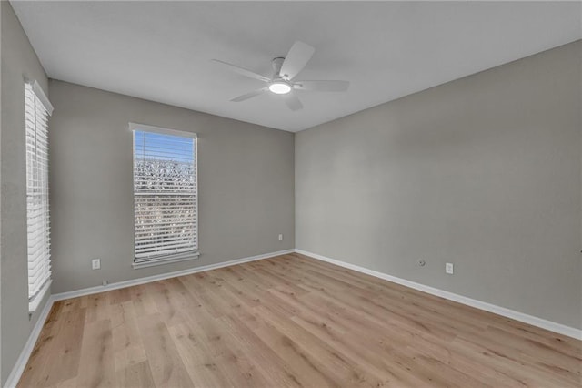 spare room featuring ceiling fan and light hardwood / wood-style floors