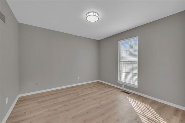 unfurnished room featuring light hardwood / wood-style flooring