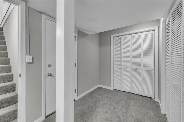 unfurnished bedroom with light carpet and two closets