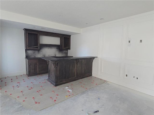 bar featuring dark brown cabinets