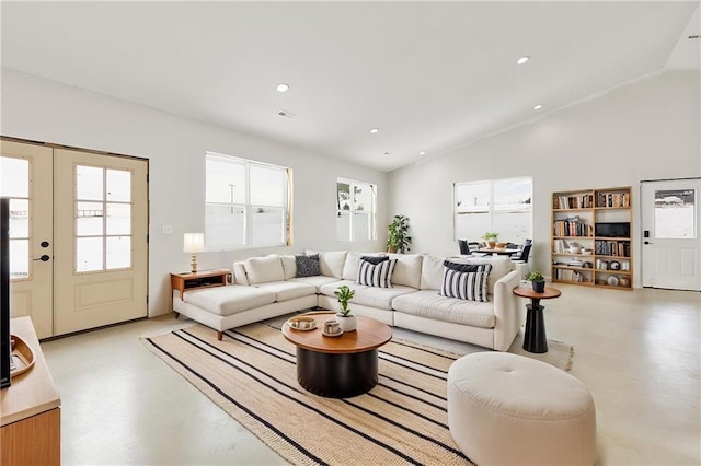 living room featuring vaulted ceiling