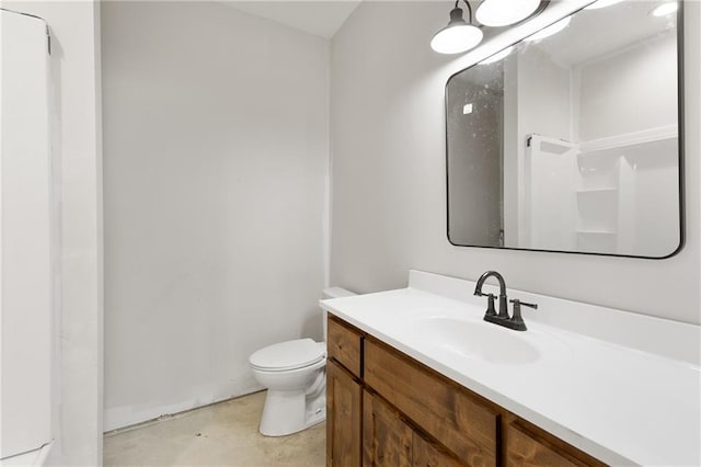bathroom with vanity, toilet, and walk in shower